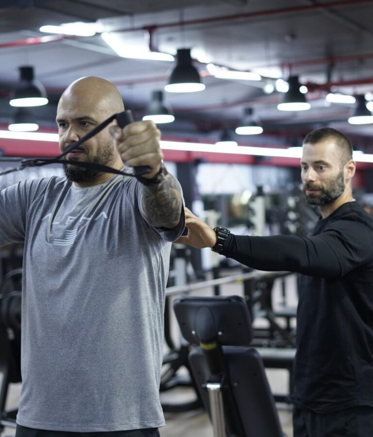 An ETAD coach guiding a client through a personal training session